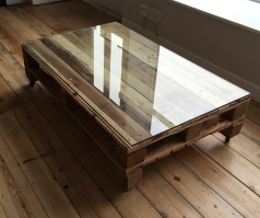 Wood pallet coffee table with glass top